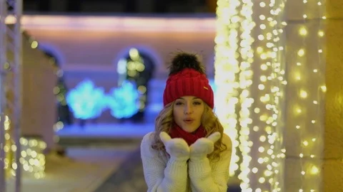 Lady wearing classic stylish winter knitted sweater and mittens. Air Kiss 스톡 동영상 119766853