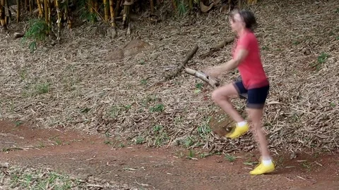 Lady Wearing a Red Blouse Jumping Rope Stock Footage 103180263