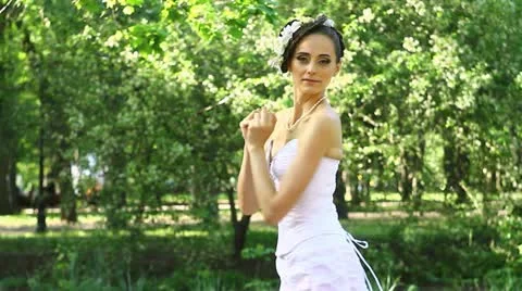 Lady in white whirling Stock Footage 10931681