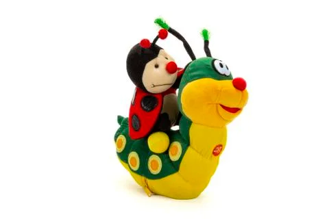 Ladybug sitting on colored stuffed worm Stock Photos