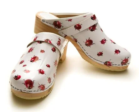 Ladybugs pattern white sabots Stock Photos