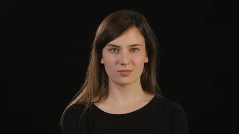 Lady's Face Smiling Against a Black Background Stock Footage 87186949