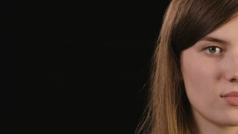Lady's Half Face Against a Black Background Stock Footage 87189778