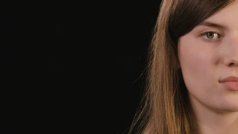 Lady's Half Face Against a Black Background Stock Footage 87189969