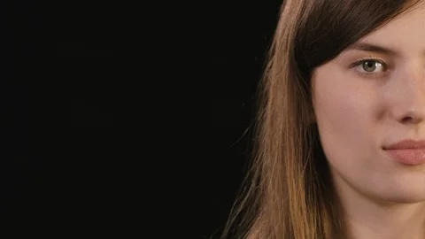 Lady's Half Face Against a Black Background Stock Footage 87190082