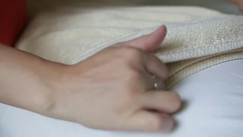 Lady's Hands Folding A Bath Towel In Slow Motion 스톡 동영상 76133740