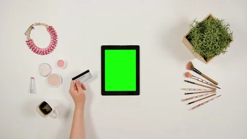 Lady's Hands Touching a Tablet and Holding a Card Stock Footage 85457878