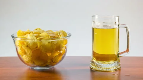 Lager beer and potato chips Stock Footage 54187161