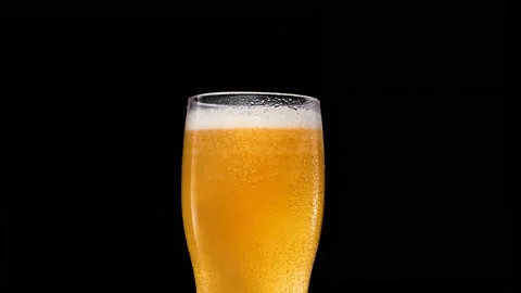 Lager Beer closeup. Cold beer isolated on matte black background.  Stock Footage 153276482