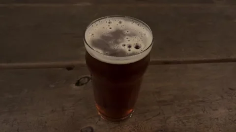 Lager cold beer outside table Stock Footage 259850065