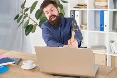 Lagging system. Hate office routine. Man bearded crush computer. Software Foto stock