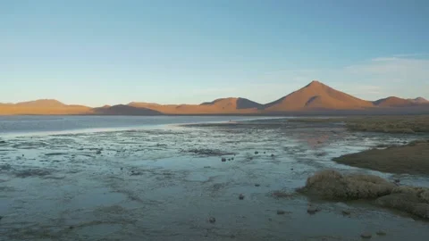 Lagoon at sunset with mountains behind, in the Sur Lipez desert, Bolivia Stock Footage 237532405