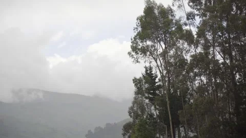 A lagoon surrounded by mountain in the valley of Stock Footage 277468888