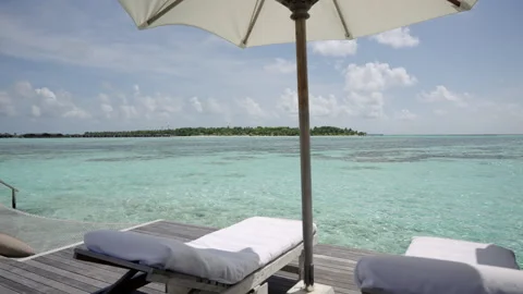 Lagoon View Beneath a Parasol at Gili Lankanfushi Maldives Stock Footage 341101512