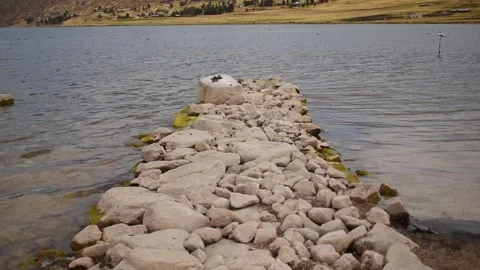 Lagoon view in horizontal format closeup with rock path Stock Footage 255983738