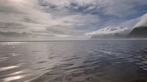 Lagoon waves rolling gently at sunset Stock Footage 160124468