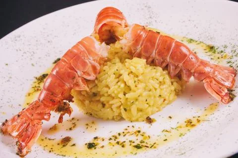Lagostin with risotto Stock Photos