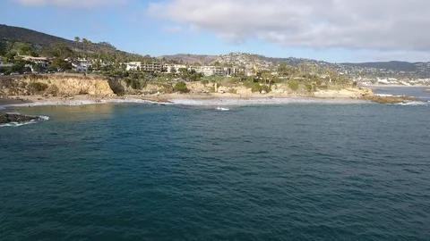 Laguna Beach Cloudy Day - Fly Up &amp; Over Toward Shore Video stock 93192278