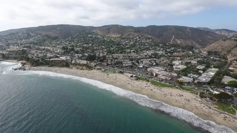 Laguna Beach Cloudy Day - High Fly &amp; Pan Down Toward Shore Stock-Footage 93220221