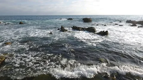 Laguna Beach Cloudy Day - Low Fly Through Rocks #1 Video stock 93643670