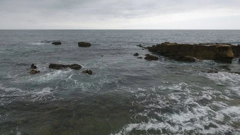 Laguna Beach Cloudy Day - Low Fly Through Rocks #2 Video stock 93644725