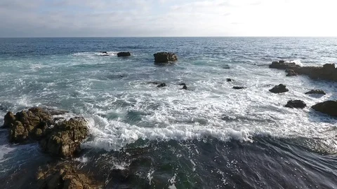 Laguna Beach Cloudy Day - Low Hover Near Rocks Stock-Footage 93645566