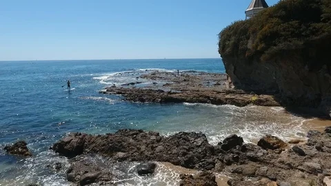 Laguna Beach - Flight Over Rocks Near Woman to Ocean Stock-Footage 94007658