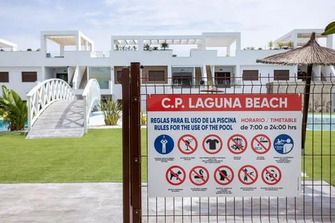 Laguna Beach pool rules sign at gated resort Stock Photos