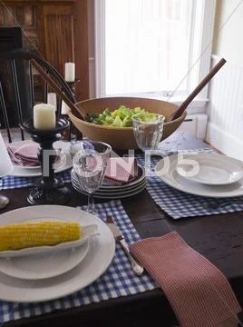 Laid Table With Corn Cob And Salad (Usa)