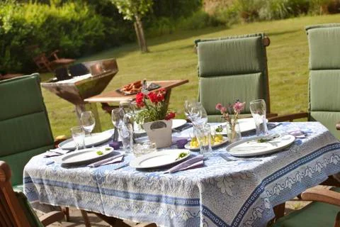 Laid table in the garden Stock Photos