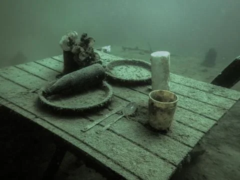 Laid table at the ground from a lake while diving Foto stock
