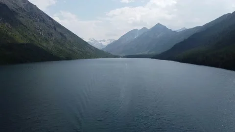 Lake against the backdrop of white mountains Stock Footage 167920118