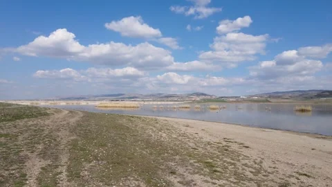 Lake And Cloudy Blue Sky Video stock 332569844