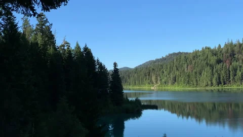 Lake and eagle diving in distance Stock Footage 146821364