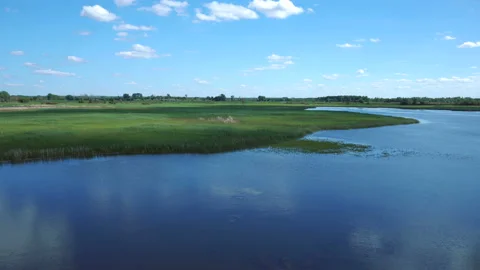 Lake and fields view from the top timelapse Stock Footage 123665799