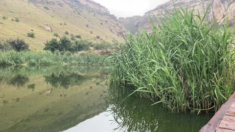 Lake and mountain with rain Stock Footage 168567780