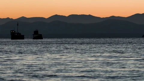 Lake and mountain ranges during sunset Stock Footage 77765051