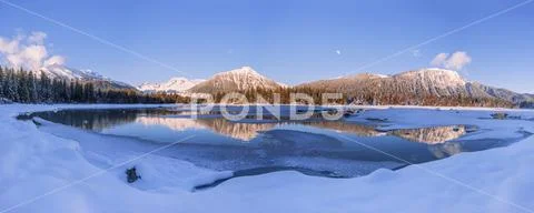 Lake and mountains in winter,Alaska, United States of America Stock Photos