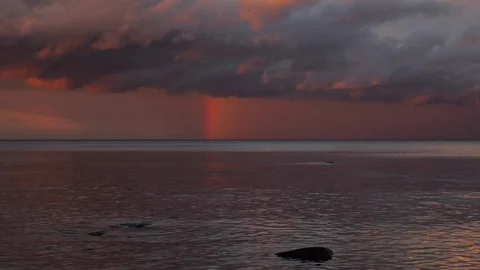 Lake and sky with rainbow. Sunset. Stock Footage 79590655