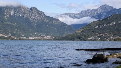 Lake of Annone with a view of the alps, italy Stock Footage