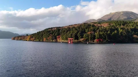 Lake Ashi Water | Torii Gate | Copy Space | Autumn - 4K Aerial Video Stock Footage 329054888