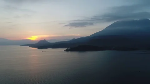 Lake Atitlan Sunrise by drone with Volcano view Stock Footage