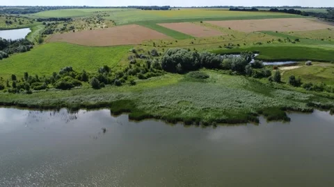 Lake background. Green river side. Panoramic flying footage. Video stock 246486235