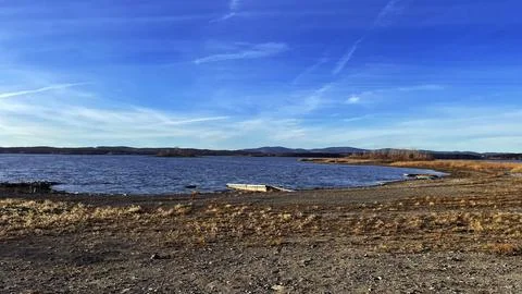 Lake on the background of mountains Stock Photos