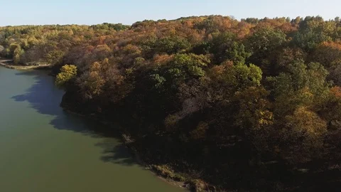 Lake background over blue sky, autumn forest Stock Footage 87836318