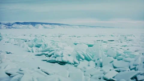 Lake Baikal, thin shards of ice. blue snow hummocks. A rare natural phenomenon Stock Footage 228826472