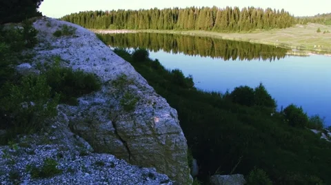 Lake between forest and mountain Stock Footage 40642123