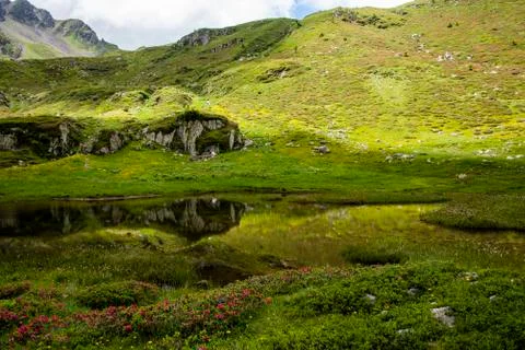 Lake between granite mountains Stock Photos