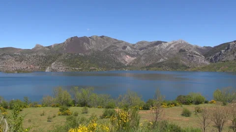 Lake between green mountains Stock Footage 25766116