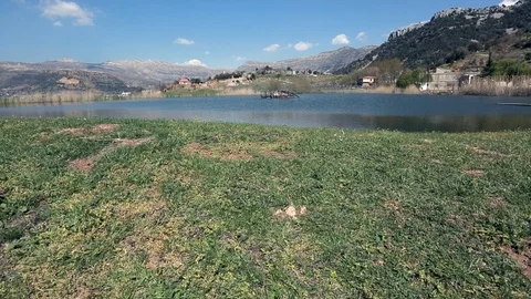 A lake between mountains at Lassa, Mount Lebanon Stock Footage 108388316